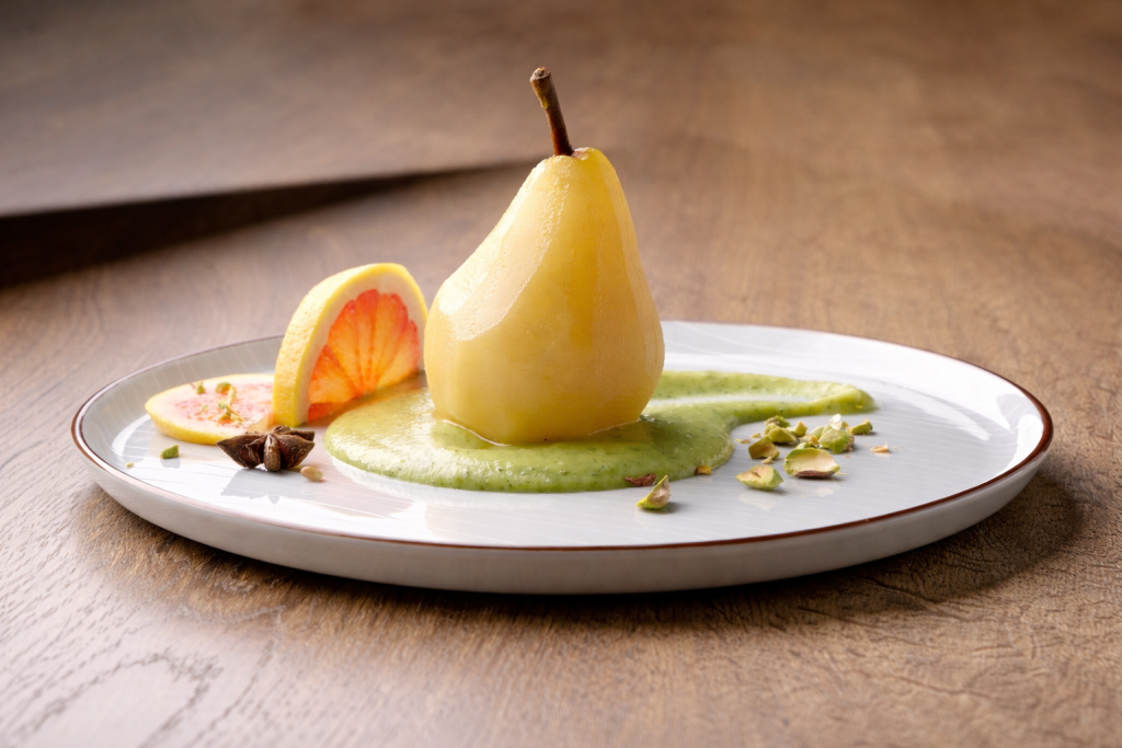 Poached pear on zucchini and pistachio puree